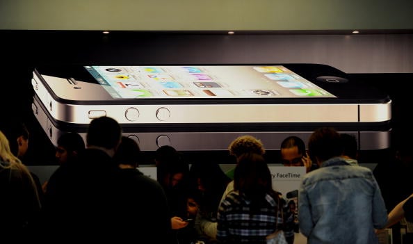 Customers inspect the new Apple iPhone 4