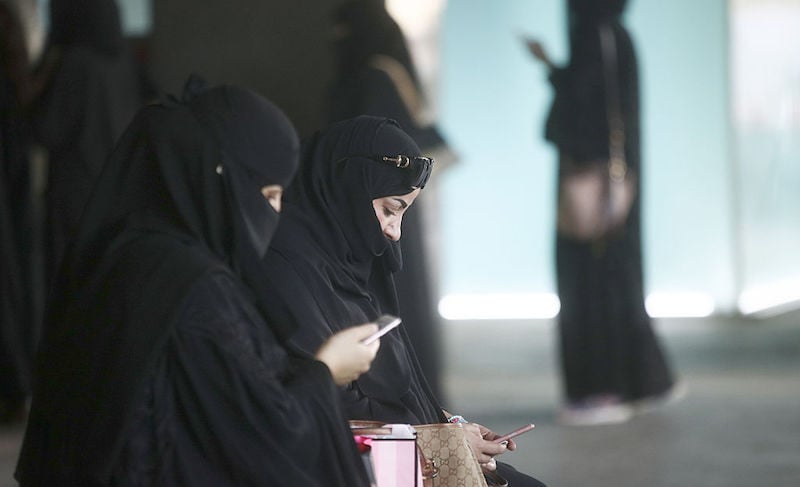 Saudi smartphone women Inside Riyadh's Kingdom Centre Shopping Mall