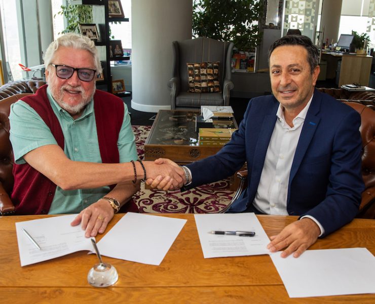 Raed Barqawi signing the publishing agreement for Who Dared to Dream: How Mohammed bin Rashid Made His Dream of Dubai Come True with Ian Fairservice, Managing Partner of Motivate Media Group