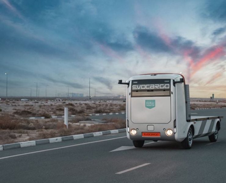 In line with Dubai’s drive to become the world’s smart mobility hub, Dubai South today signed a memorandum of understanding (MoU) with Evocargo for the launch of the UAE’s first autonomous vehicle trials for cargo at the master development’s Logistics District. The trials will see EVO.1, Evocargo’s unmanned electric logistics vehicle, navigate Dubai South’s Logistics District from December until February 2023. A key objective of the trials is to enable Evocargo to modify and redesign EVO.1 specifically for the MENA region. During the trial period, a remote operator will be stationed onsite in the Control Centre to manage the platform. The centre, located in Dubai South’s Logistics District, includes a software suite to monitor the EVO.1’s operation, check the serviceability of the sensors, and identify any errors. Mohsen Ahmad, CEO of the Logistics District – Dubai South, and Andrey Bolshakov, Founding CEO, Evocargo, attended the MoU signing ceremony. Dubai South is the emirate’s largest single-urban master development focusing on aviation, logistics and real estate. The Dubai-headquartered Evocargo is a logistics service provider that develops and provides electric autonomous transportation platforms. Dubai is a global logistics hub with an unrivalled freight capacity and connectivity. Perfecting electric and driverless truck technology for the region will help it further reduce its carbon footprint and reinforce the city’s green credentials. Unlike other cities’ and countries’ initiatives that focus solely on enabling self-driving private vehicles, Dubai’s Self-Driving Transport Strategy is multimodal and encompasses targeting all seven modes of the public transport fleet, including metro, tram, bus, taxi, marine transport, cable cars and shuttle. When fully implemented, the strategy will help reduce transportation costs by 44% or Dh900 million, saving Dh1.5 billion through the reduction of environmental pollution and Dh18 billion through raising the efficiency of the transport sector by 20%. Mohsen Ahmad said: “We are delighted to enter into a strategic agreement with Evocargo to launch the UAE’s first autonomous trials, setting new global benchmarks and consolidating the leadership status of the country’s logistics sector. Besides improving operational efficiency, our partnership will help scale supply chain operations and achieve sustainability. At the Logistics District, we are mandated to support the industry and accelerate the UAE’s rapidly advancing logistics sector.” Andrey Bolshakov said: “This is Evocargo’s first venture into autonomous vehicles in such a global multimodal logistics platform. This trial is a significant milestone for the company as it unlocks opportunities to expand our products in the strategic Middle Eastern and Asian markets.” EVO.1: Effective, Electric, Eco-friendly The lifting capacity of the driverless platform is 2 tonnes, and it can accommodate up to six EUR-pallets moving at 25 km/h for up to 200km. Charging a vehicle for a full day’s operation takes 40 minutes to six hours, depending on the outlet. The security system of the EVO.1 platform has four tiers: the computer vision of the space around the vehicle, an automatic diagnostic system, a remote-stop system, and a standby pneumatic braking system. Effective fleet management of EVO.1’s automatic pilot systems increases the efficiency of freight transportation while significantly reducing truck downtime. Robotisation and using electricity and hydrogen fuel cells instead of conventional fuel offer cost efficiencies. Evocargo has 37 protected inventions and technologies. Evocargo’s patents cover algorithms for visual positioning, automatic mapping, the calibration and integration of sensors and cameras, methods for selecting safety speeds, and the parameters for dynamic models.