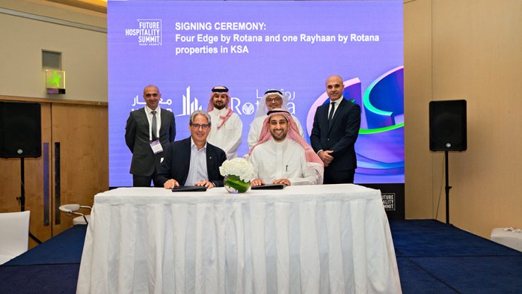 Rotana's Guy Hutchinson signs the agreement at the FHS in Riyadh. (Image: Supplied by Rotana)