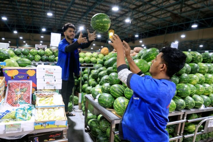 food - Workers organise a watermelon stall at a fresh produce market in Dubai on March 21, 2023 ahead of the Muslim holy fasting month of Ramadan. (Photo by Karim SAHIB / AFP) (Photo by KARIM SAHIB/AFP via Getty Images)