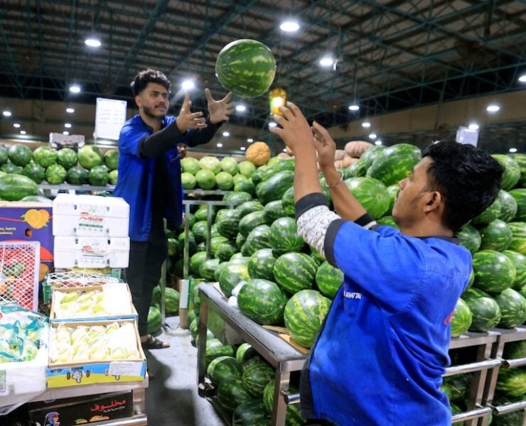 food - Workers organise a watermelon stall at a fresh produce market in Dubai on March 21, 2023 ahead of the Muslim holy fasting month of Ramadan. (Photo by Karim SAHIB / AFP) (Photo by KARIM SAHIB/AFP via Getty Images)