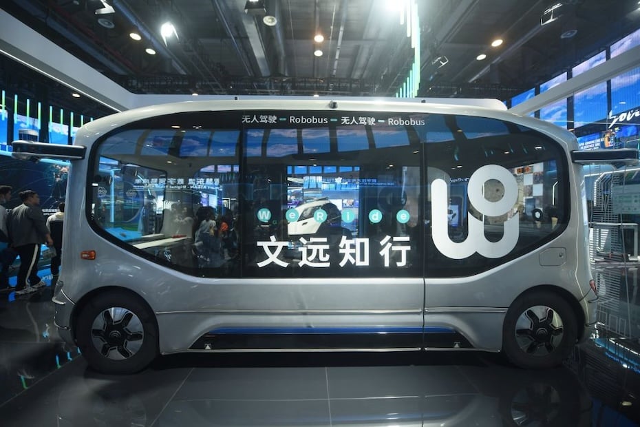 HANGZHOU, CHINA - NOVEMBER 23, 2023 - Visitors look at WeRide's driverless minibus at the 2nd Global Digital Trade Fair 2023 in Hangzhou, Zhejiang province, China, Nov 23, 2023. (Photo credit should read CFOTO/Future Publishing via Getty Images)