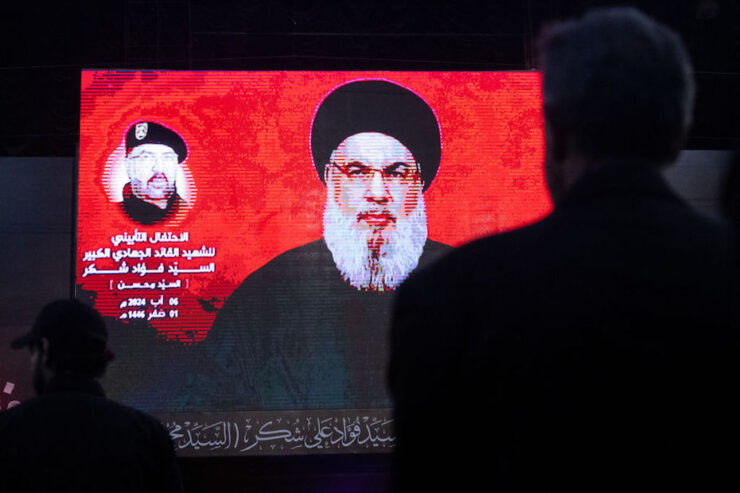 BEIRUT, LEBANON - AUGUST 06: Supporters listen to Hezbollah leader Sayyed Hassan Nasrallah via a video link during a ceremony to mark the first week since the killing of Hezbollah's top commander Fuad Shukr on August 06, 2024 in Beirut, Lebanon. (Photo by Chris McGrath/Getty Images)