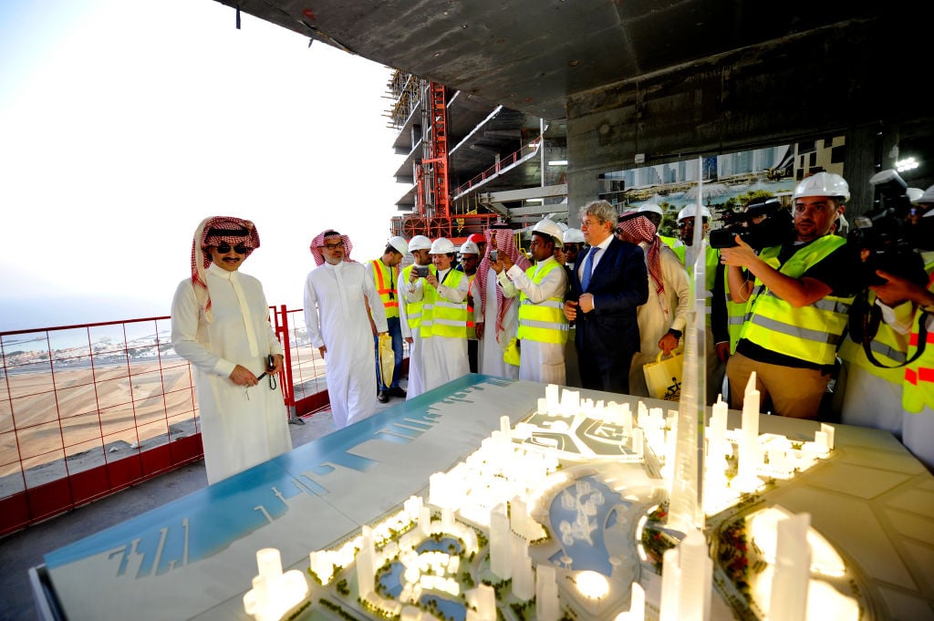 Saudi Prince Alwaleed bin Talal (left) looks at model of Jeddah Tower ahead of a press conference on May 11, 2017, in the Red Sea city of Jeddah. (Photo credit should read AMER HILABI/AFP via Getty Images)