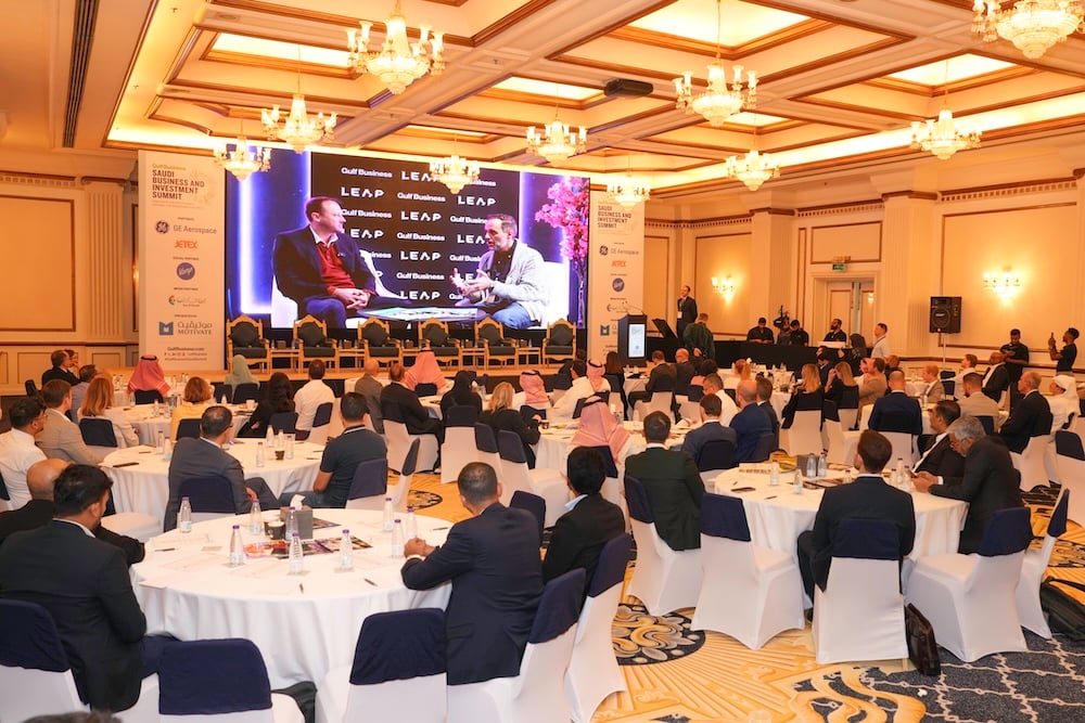 Attendees watching the Gulf Business showreel.