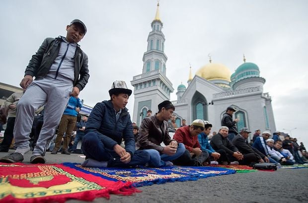Muslims attend a morning prayer to mark Eid al-Adha in Moscow.