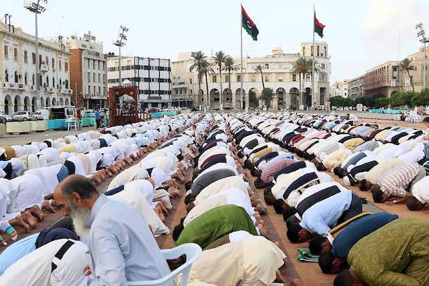 Muslim Libyan men perform the morning Eid al-Adha prayer on Martyrs' square in the capital Tripoli.
