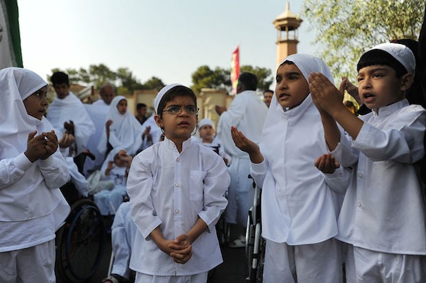 Iranian children reenact some parts of the haj pilgrimage, as Iranians marked the Eid Al-Adha Islamic tradition with the slaughter of hundreds of sheep at the Kahrizak Charity Foundation in Tehran.