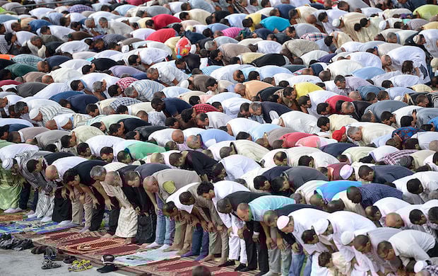 The prayer of the local Muslim community during the Eid al-Adha in Turin, Italy at Parco Dora (Dora Park). 
