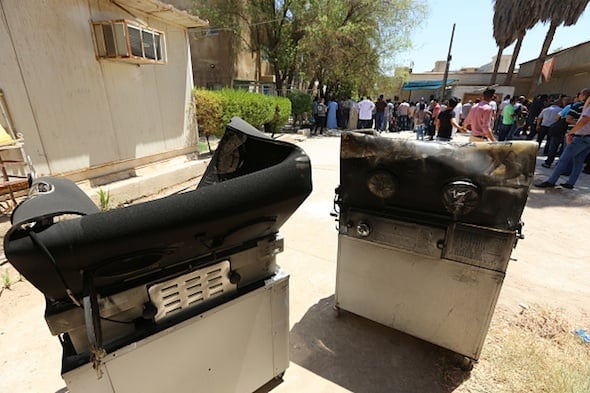Burnt incubators stand outside Yarmuk hospital 